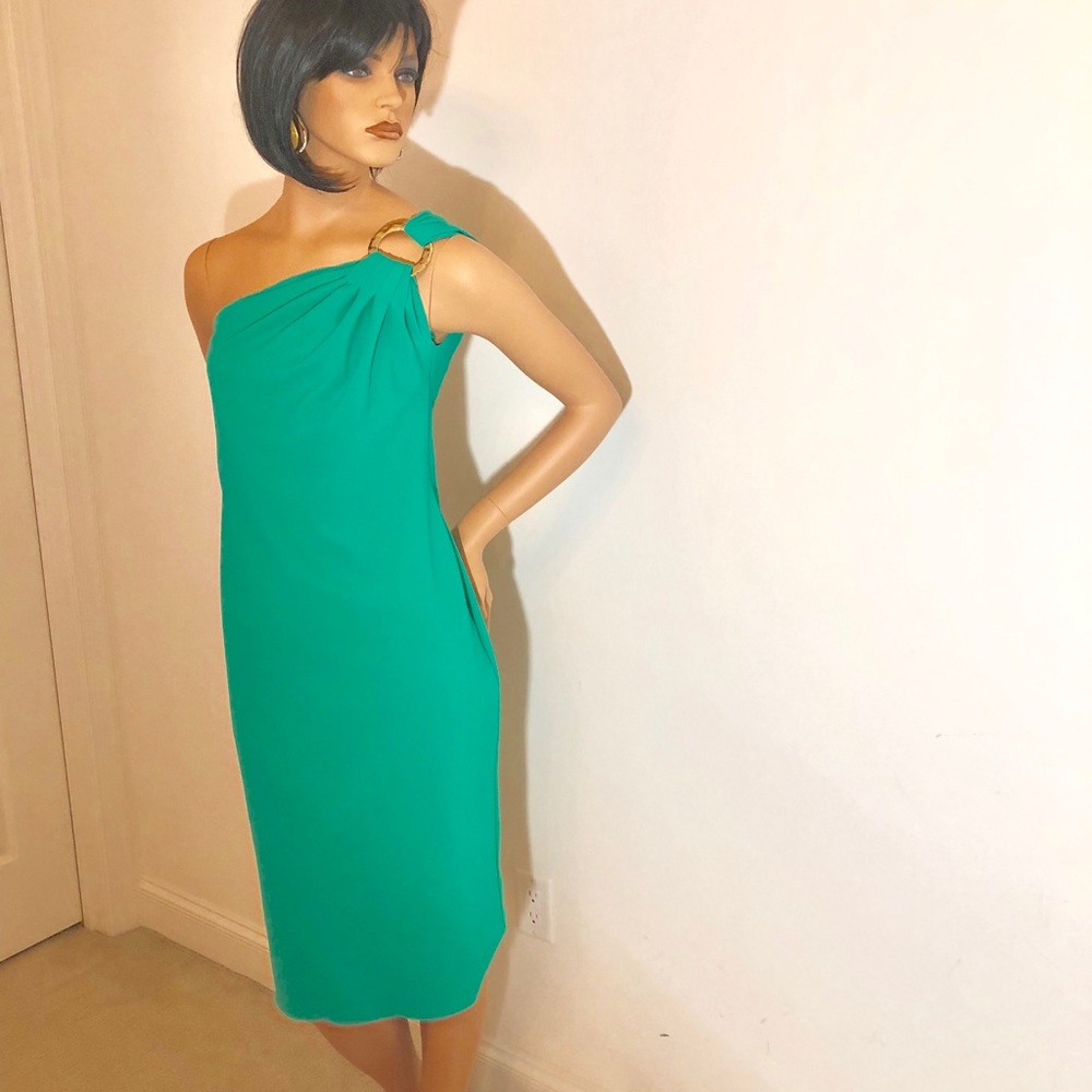 One shoulder green dress with gold clasp.